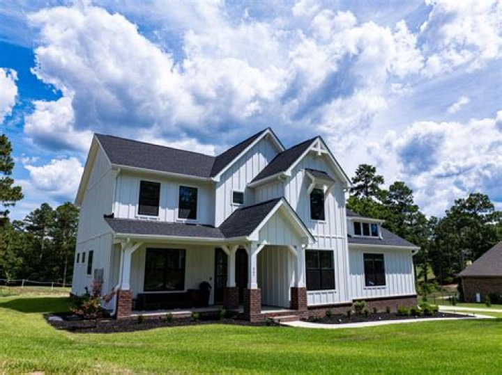 Is it cheaper to build a house on your own land?