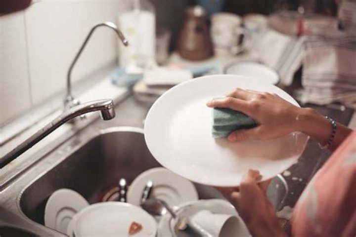 Is it cheaper to use a dishwasher or wash by hand?