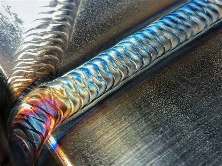 What causes rainbow on stainless steel?