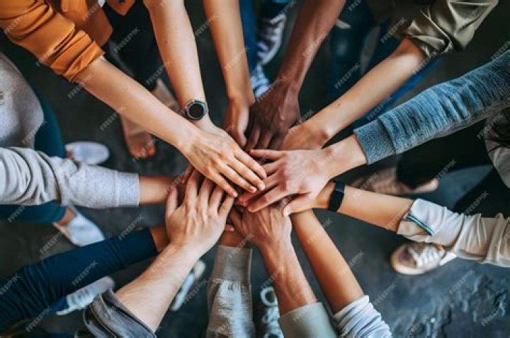 What is it called when a group of people join together to get something done?