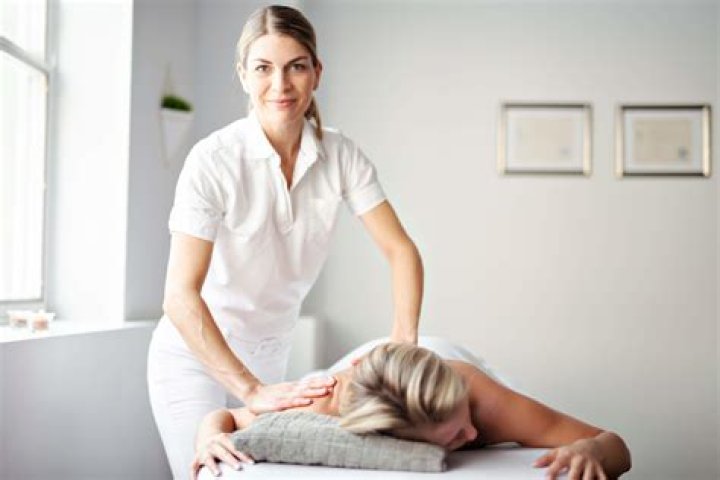 What is the role of a massage therapist?